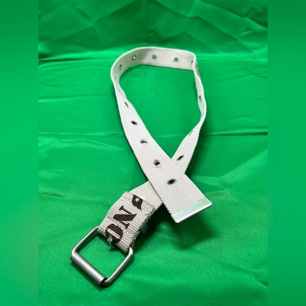 Cream color canvas belt with greenish brown lettering